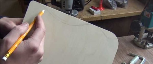 The required pattern is drawn on plywood