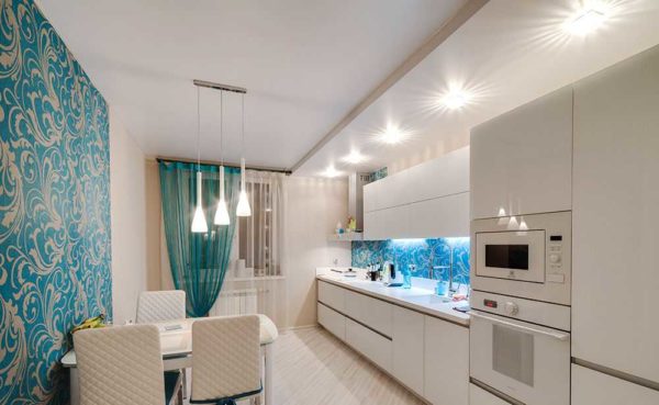 In the kitchen, you can hang a chandelier above the dining table, and illuminate the rest of the area with built-in lamps