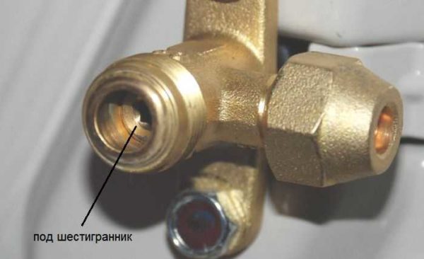 There is a hexagon valve under the cover