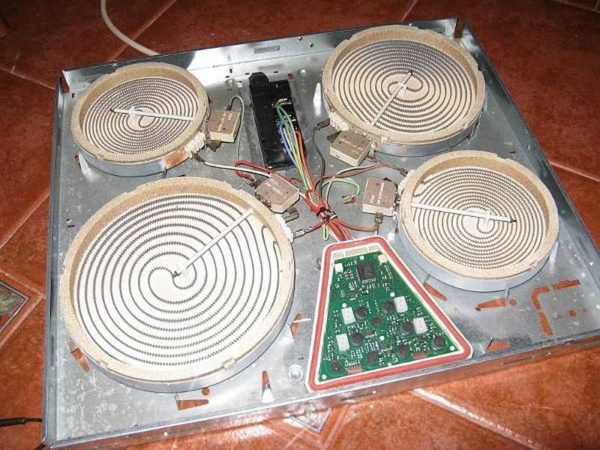 By removing the ceramic plate, we gain access to the electrical components