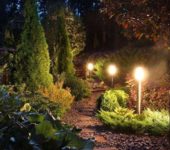 Such lighting can be done using ordinary lamps and a cable stretched between them or by installing solar-powered lamps.