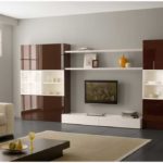 Traditionally, the TV is in the center and there are cabinets on the sides. So that they are not heavy, the middle is framed in light beige