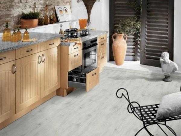 White linoleum in the kitchen with imitation of a wooden floor