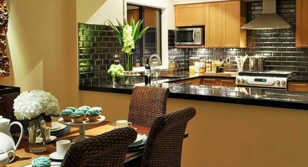 Wall decoration in the kitchen requires careful selection of material