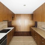 All walls in the kitchen are decorated with MDF