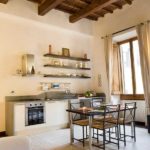 Light beige paint on walls with dark wood trim and beams