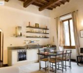Light beige paint on walls with dark wood trim and beams