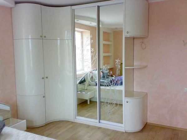 White gloss and mirror. This solid size cabinet does not look bulky at all