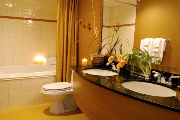 The combination of tiles and paint in the bathroom is beautiful and practical