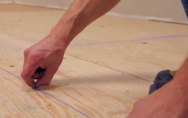 Find the center of the room before laying the cork floor.