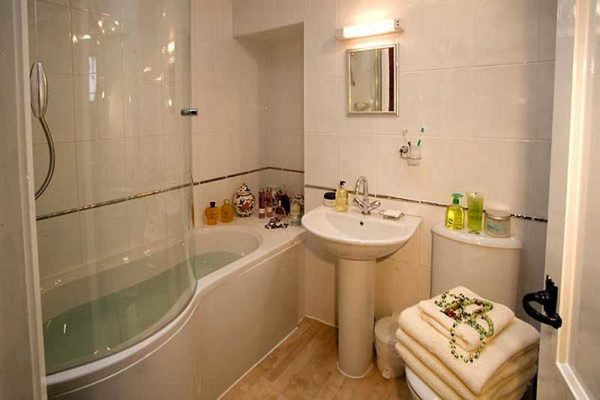 One of the options is to put a shower stall with a deep tray or simply install glass doors on the bathroom.