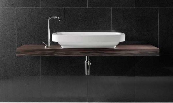 The countertop for the bathroom under the sink is made of wood including