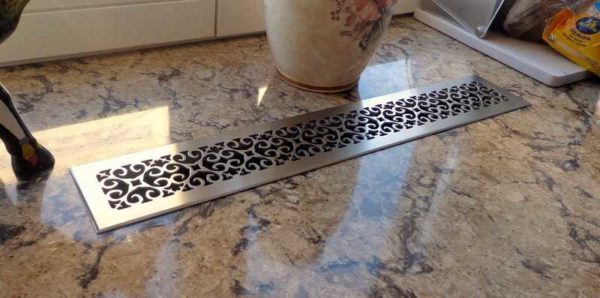 When installing radiators in the floor, grilles are also installed above them to leave warm air
