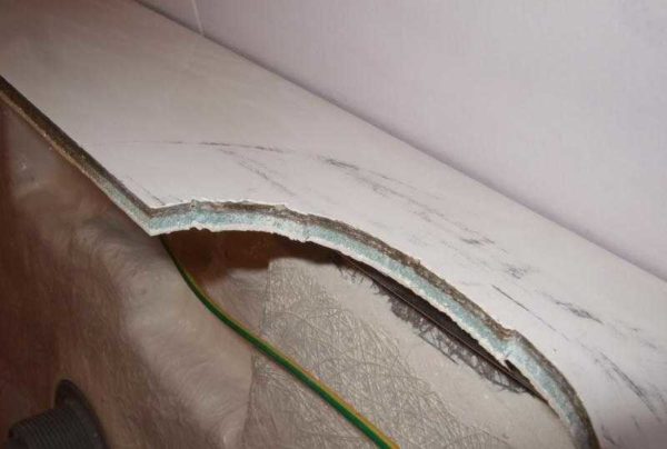 A very thin white layer - this is the acrylic layer in this instance
