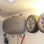 Drive pins of sufficient length into the wall, but such that the pin does not stick out of the tire