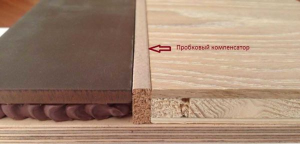 This is how the joint between laminate and tile with a cork expansion joint looks like