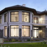 The unusual shape of the house is emphasized by large windows