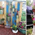 Even an old dry tree can become the basis for a vertical flower garden.