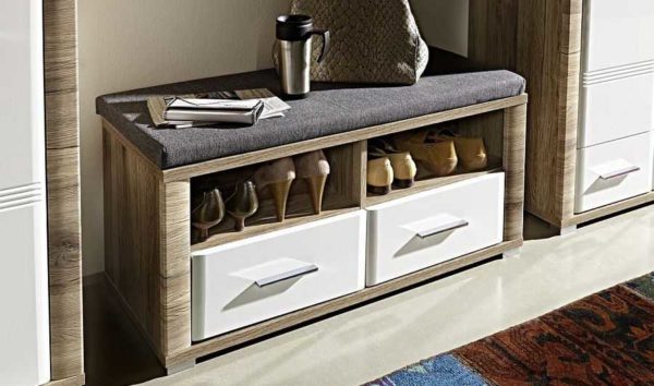 A shoe rack made of chipboard or MDF is the most common type
