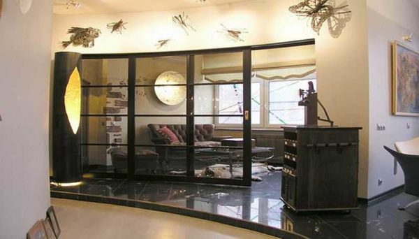 Framed glass partitions in an apartment or house look very good ... the main thing is that the style matches