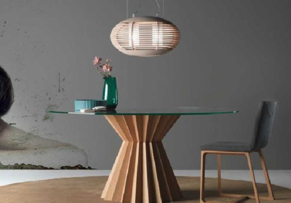 The look and style of the glass table is set by the support