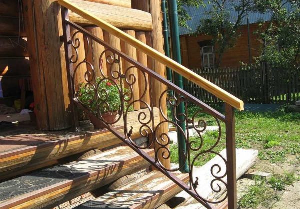 Make holes in the upper lintel and fix the railing with screws through them