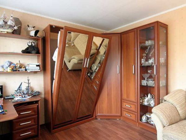 The bed can be built into a furniture wall with a corner wardrobe