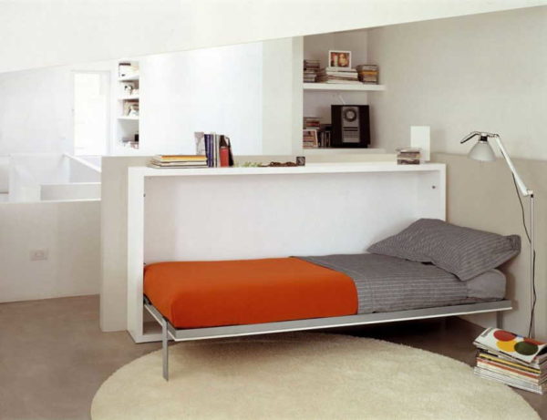 The bed-cabinet can serve as a division of the room into zones