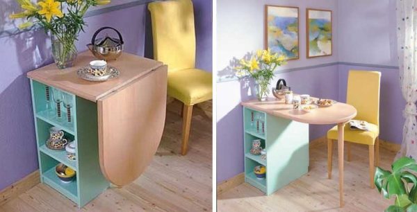 Folding table for a small kitchen attached to a cabinet