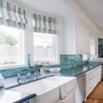 One of the colors on the roman shade matches the finish