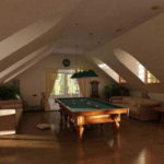 Billiard room on the attic floor - classic design, walls and ceiling are smooth, white