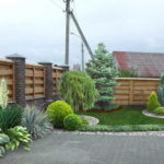 Taller plants are planted closer to the fence