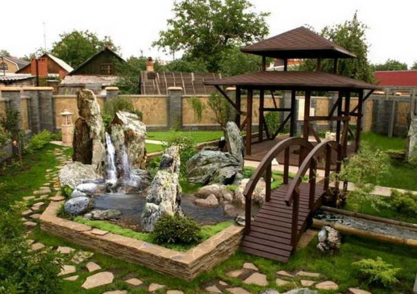 The courtyard of a private house with a fountain and a stream - stylish and beautiful