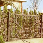On a stone foundation, metal pillars and forged sections