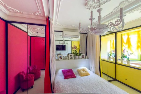 Bright bedroom decorated with stucco decoration