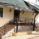 Long visor not only above the porch, but also above the entrance path