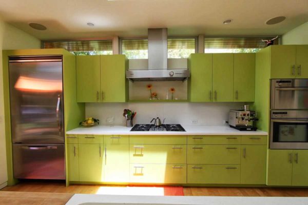 Apple green is accentuated by the warm shade of the floor
