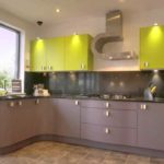 The bright green of the wall cabinets compensates for the dark apron and base cabinets