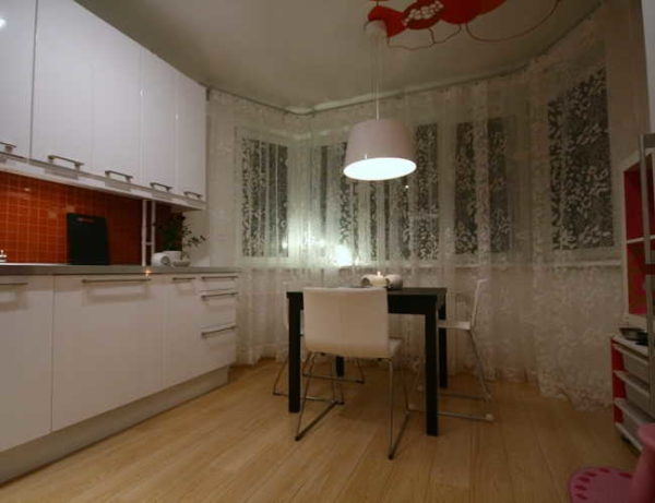 To hang curtains in a bay window, use special curtain rods - flexible, ceiling or wall