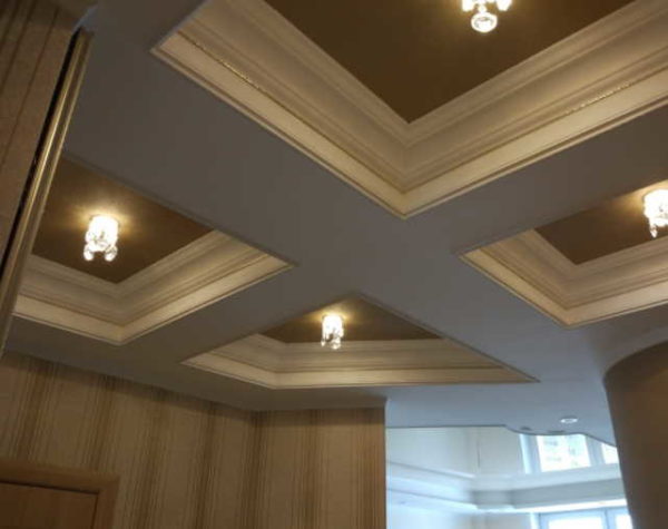 A coffered ceiling can hide beams, pipes, and other unsightly elements