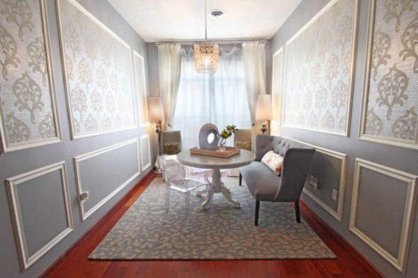 You can insert beautiful wallpaper into the frames of moldings