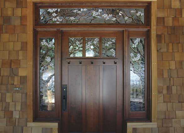 This design of the entrance to a private house could be called traditional .. but the stained glass window makes it unusual and memorable
