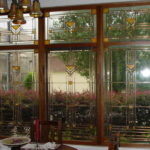 Stained-glass windows in the interior look best on large windows - in a bay window or with solid glazing