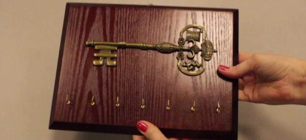 Well-crafted piece of wood with embellishment and hooks