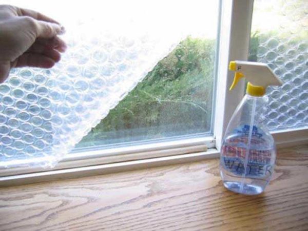 You can do it easier - stick the bubble wrap on the glass from the inside