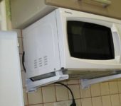 How to hang a microwave: one of the options is on brackets