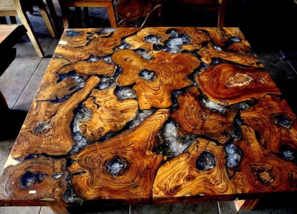 Designer furniture made of wood and epoxy resin. The second one is definitely not the same