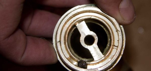Any kind of debris interferes with the closing plate