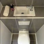 Non-standard placement of the washbasin in the toilet